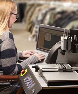 Girl using U-MARQ GEM-FX5-engraver